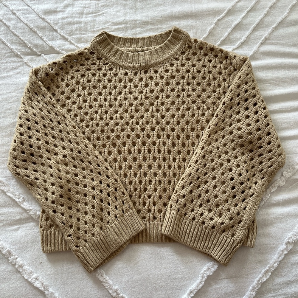 Tan and brown knit sweater with a relaxed fit